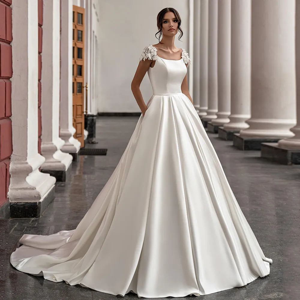 Gorgeous Satin Wedding Dresses Cap Sleeve Scoop Neck Flowers Court Train A Line Princess Bridal Gowns With Pockets Vestidos De Gorgeous Satin Wedding Dresses Cap Sleeve Scoop Neck Flowers Court Train A Line Princess Bridal Gowns With Pockets Vestidos De
